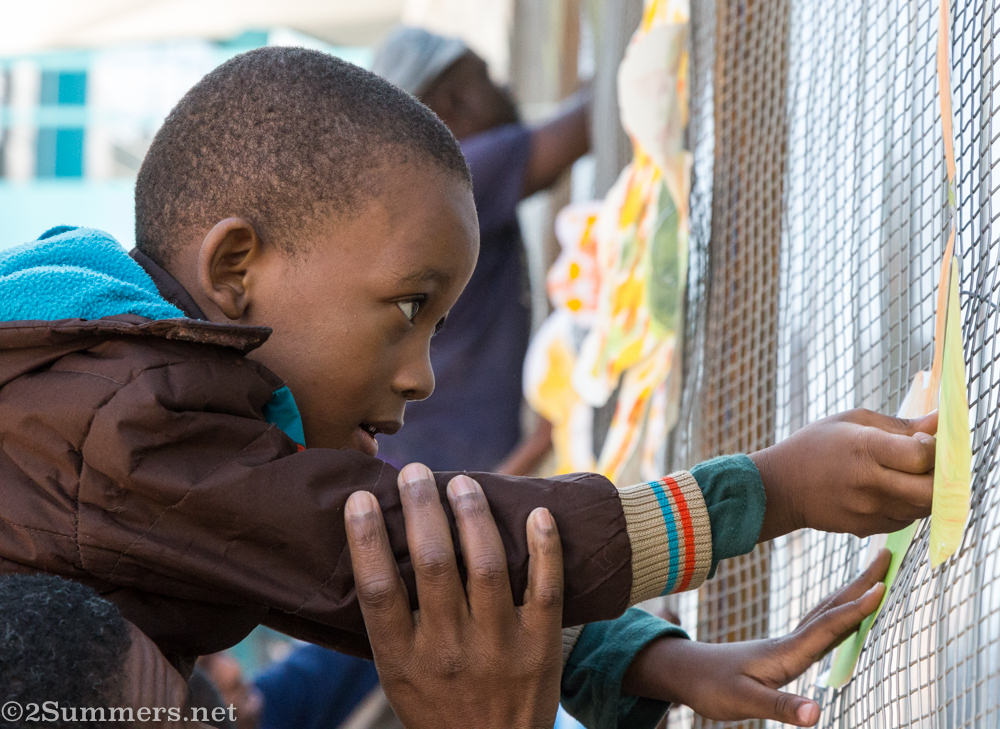 Kid with flower at Joziburg Lane