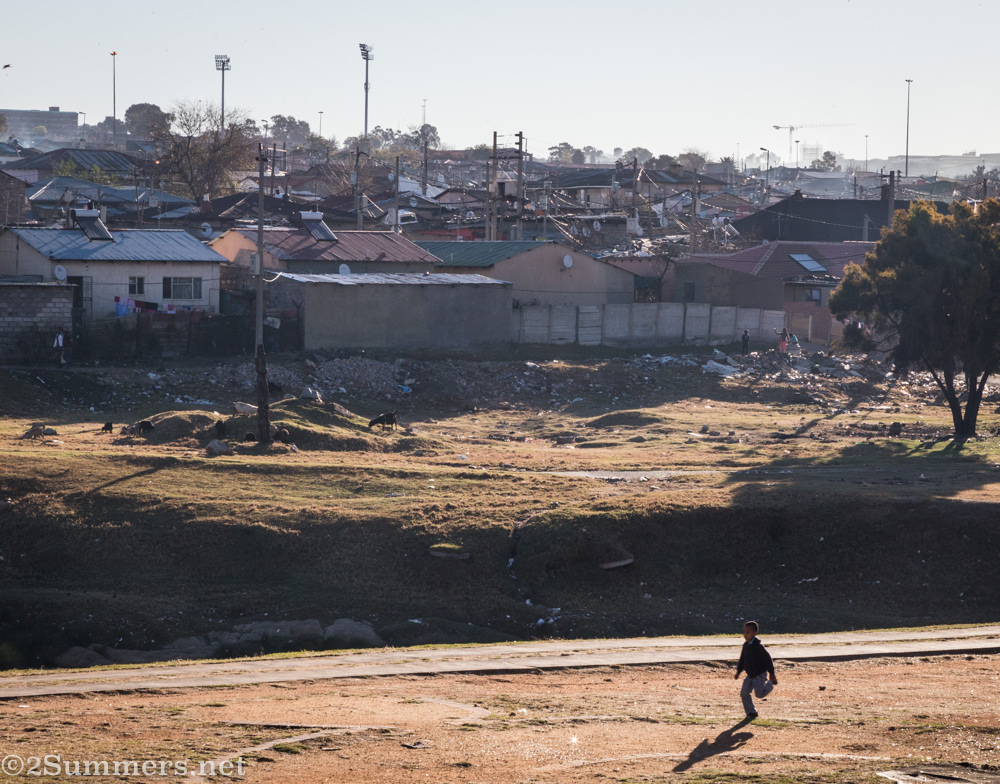 Child on the Jukskei River in Alexandra