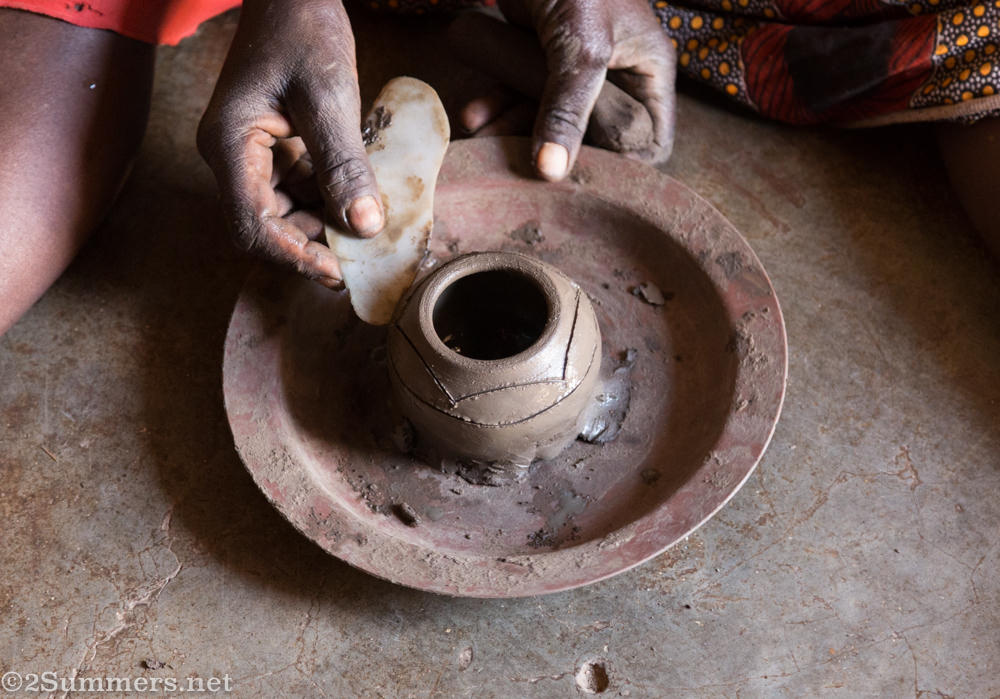 Carving a pattern into the pot