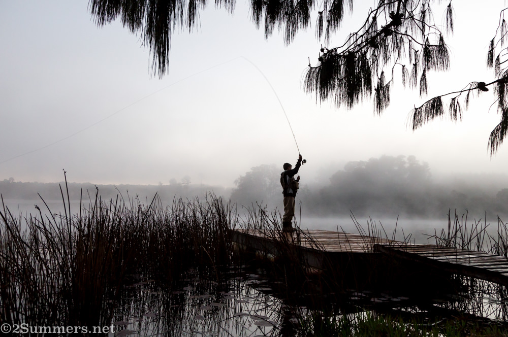 Young kid flyfishing on deck