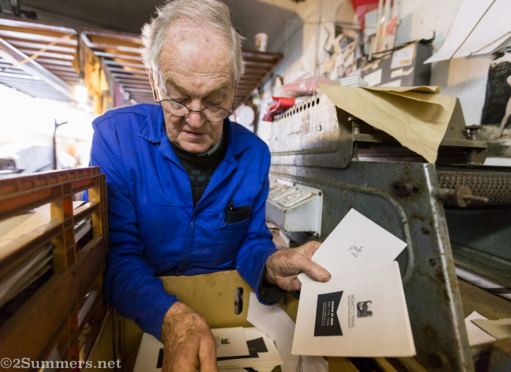 Ted flipping through his printing work