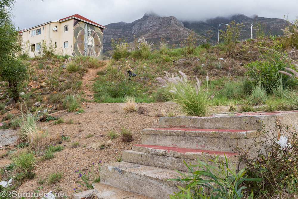 Faith47 piece with District Six stoeps in the foreground