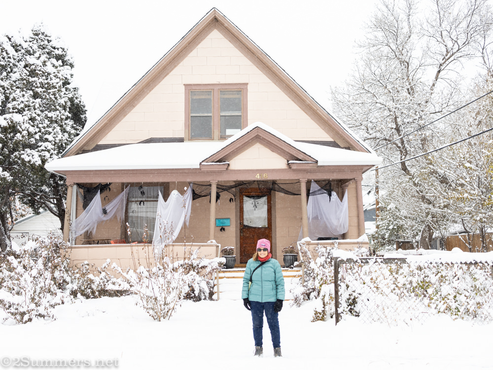 Mom in front of a house