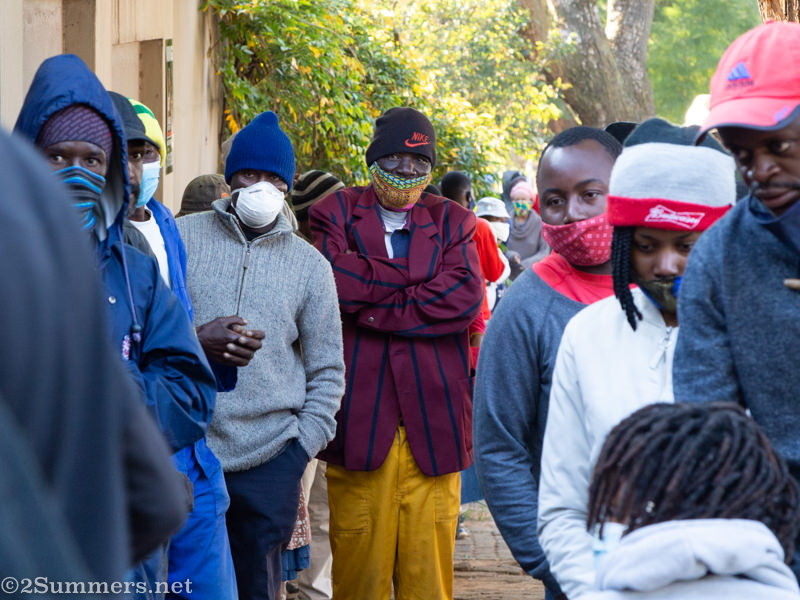 People waiting in line for food parcels