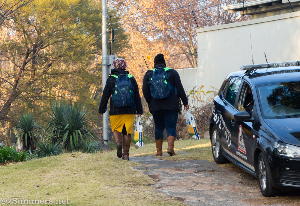 Ladies walking away with backpacks