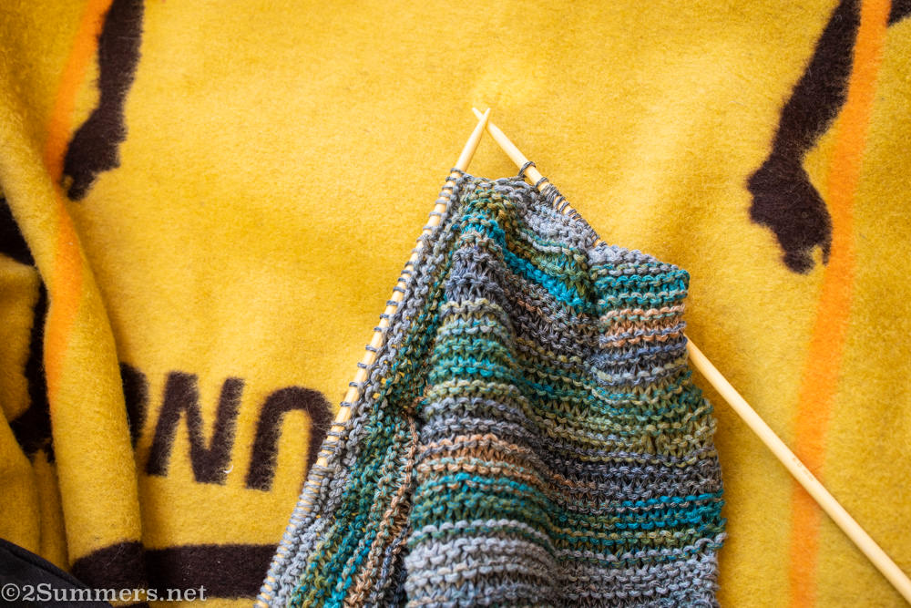 knitting on a Basotho blanket