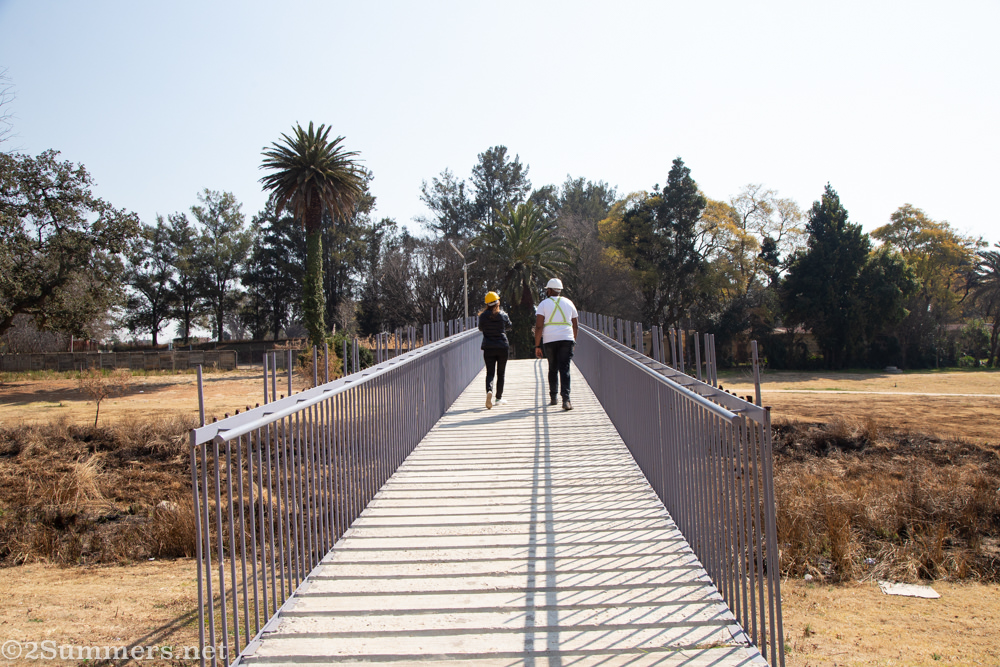 Walking across a bridge in Paterson Park