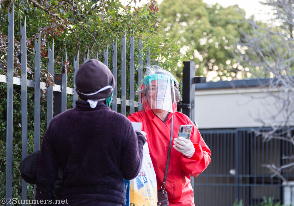 Tanya takes recipient photos at the Melville Food Program