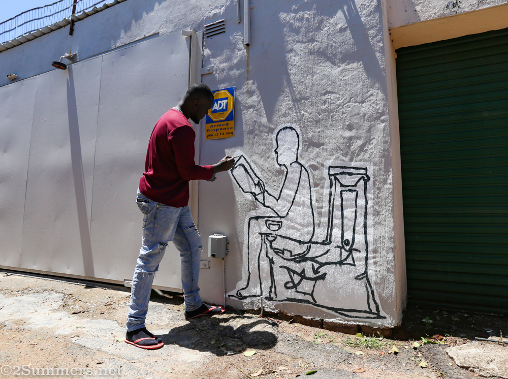 Steve painting a toilet