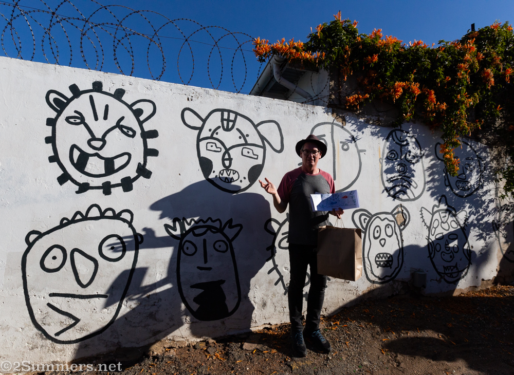Thorsten in front of art in a Brixton alley