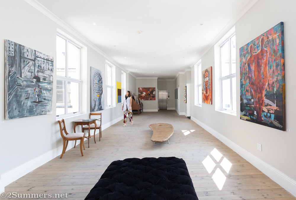 Attiya looking at art at the Rand Club