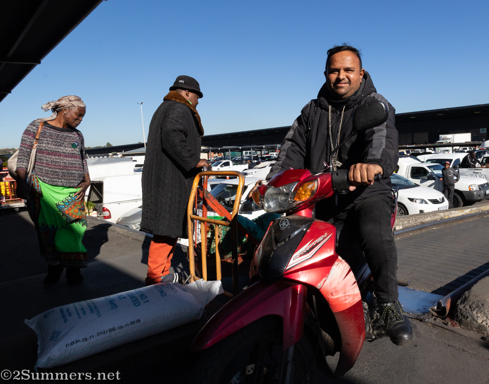 Guy on scooter at the produce market