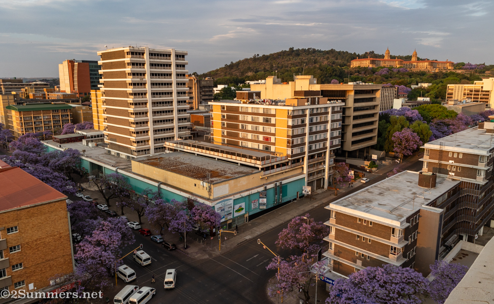 Through the window of a downtown Pretoria apartment building, with the Union Buildings in the distance